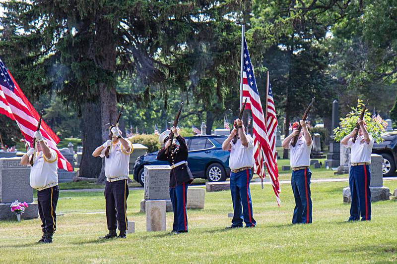The Dixon area Detachment Marine Corps League fires a volley of gunfire in recognition of Memorial Day, May 29, 2023 at Oakwood cemetery.