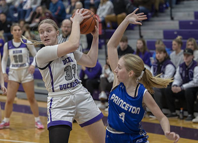 Dixon’s Jessie Pitman looks to make a play against Princeton’s Paige Jesse Thursday, Jan. 4, 2024 at Dixon High School.