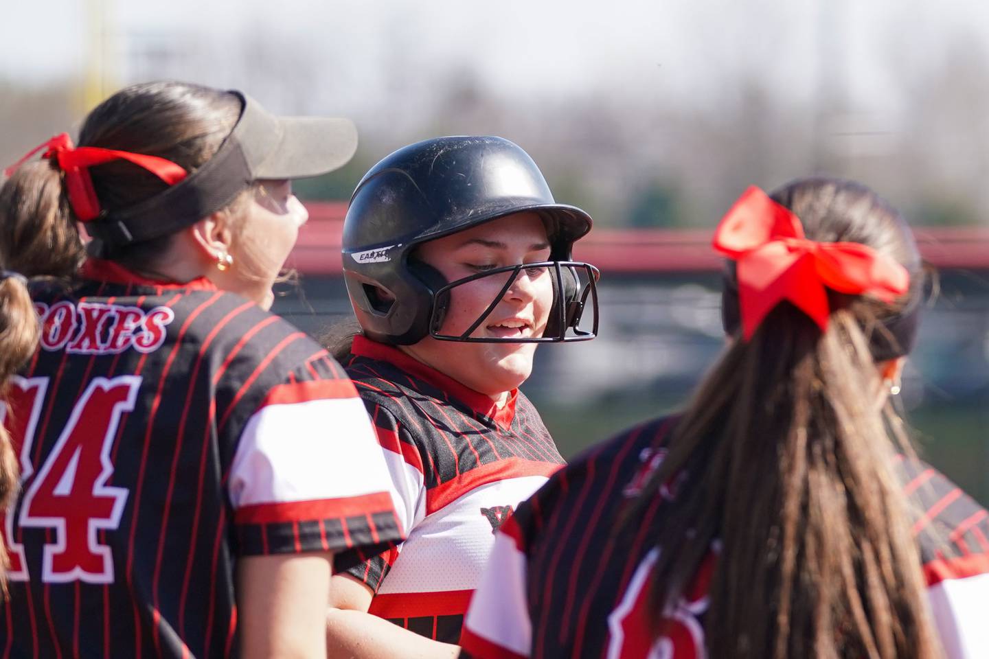 Yorkville's Kayla Kersting (center), is greeted at home plate after hitting a homer in the bottom of the first against Antioch during a nonconference softball game at Yorkville High School on Saturday, April 12, 2025.