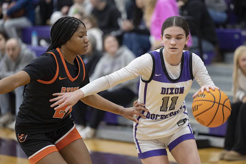 Dixon’s Kiley Gaither works against Byron’s Malia Morton Saturday, Dec. 27, at the Duchesses Basketball Christmas Classic.