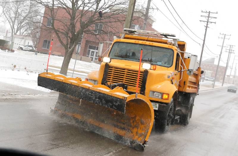 A City of Sycamore plow clears the roads Thursday, Feb. 16, 2023, on DeKalb Avenue near the Sycamore Police Station. Winter weather and icy roads caused travel difficulties in DeKalb County Thursday.