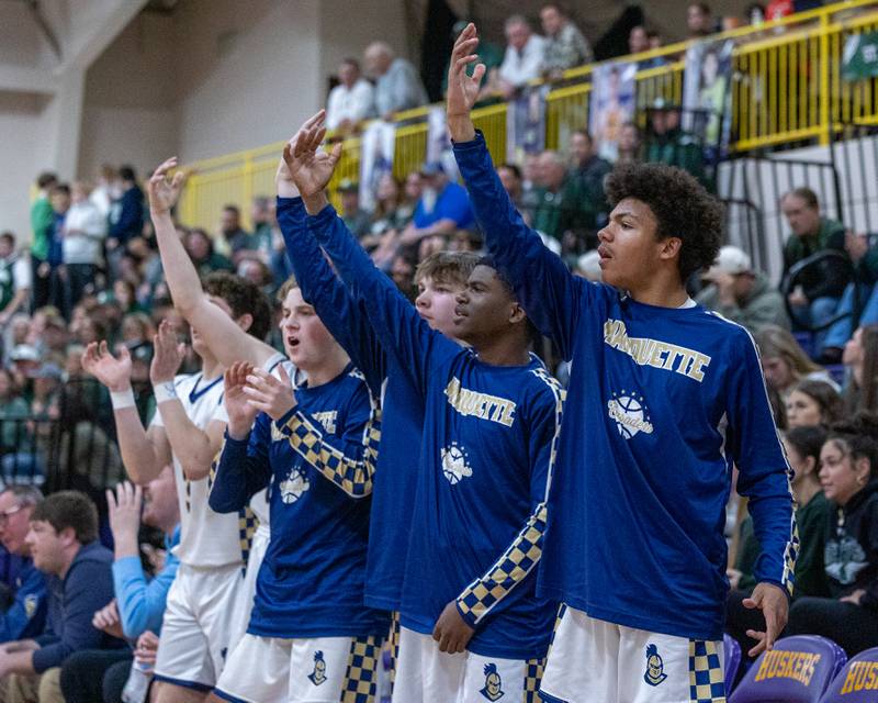 Marquette's bench reacts after teammate scores 3-pointer during the Class 1A Regional Boys Basketball Championship game on Friday, Feb. 27, 2026 at Serena High School.