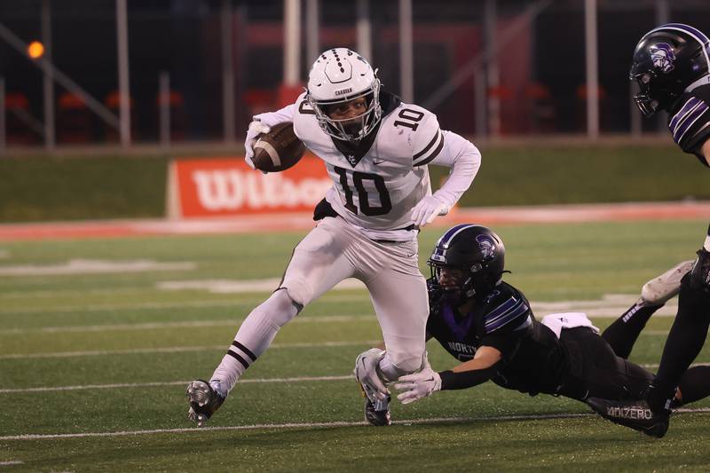 Mt. Carmel’s Maurice Densmore runs after a catch against Downers Grove North in the Class 7A championship on Saturday, Nov. 25, 2023 at Hancock Stadium in Normal.