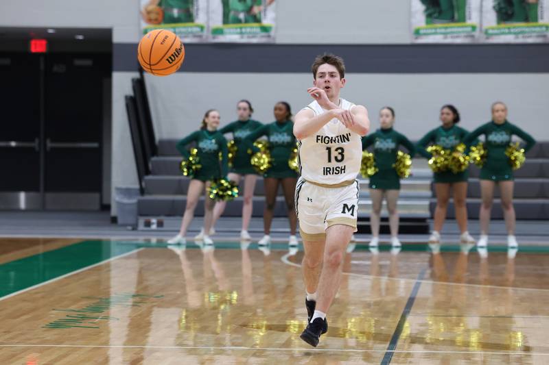 Bishop McNamara's Teddy Fogel sends a pass during the Fightin' Irish's 61-24 victory over Wilmington in the IHSA Class 2A Seneca Sectional semifinal on Tuesday, March 3, 2026.