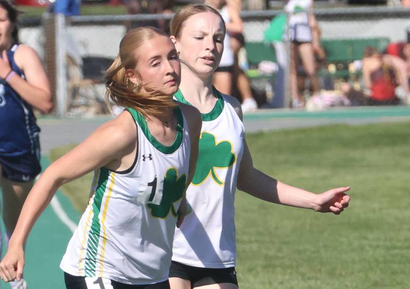 Seneca's Chapman Cora has the baton handed to her by Emberlyn Paquette in the 4x800 meter run during the Class 1A Sectional meet on Thursday, May 14, 2026 at Seneca High School.