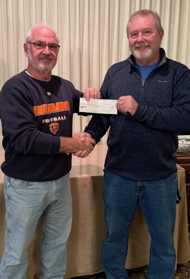 Spring Valley Boat Club donated to thee Putnam County Community Center. (From left) Putnam County Community Center Board Vice President Robert Cofoid accepts the donation from Nick Troglio, representative for the Spring Valley Boat Club.
