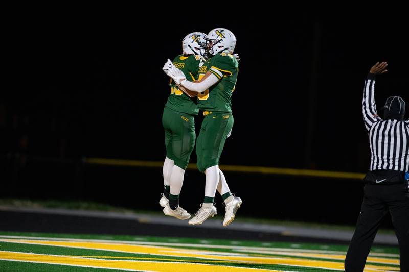 Coal City's Gavin Berger and Logan Natyshok celebrate a touchdown during the first round IHSA class 4A playoffs against Johnsberg on Friday Nov. 1, 2024 at Coal City High School