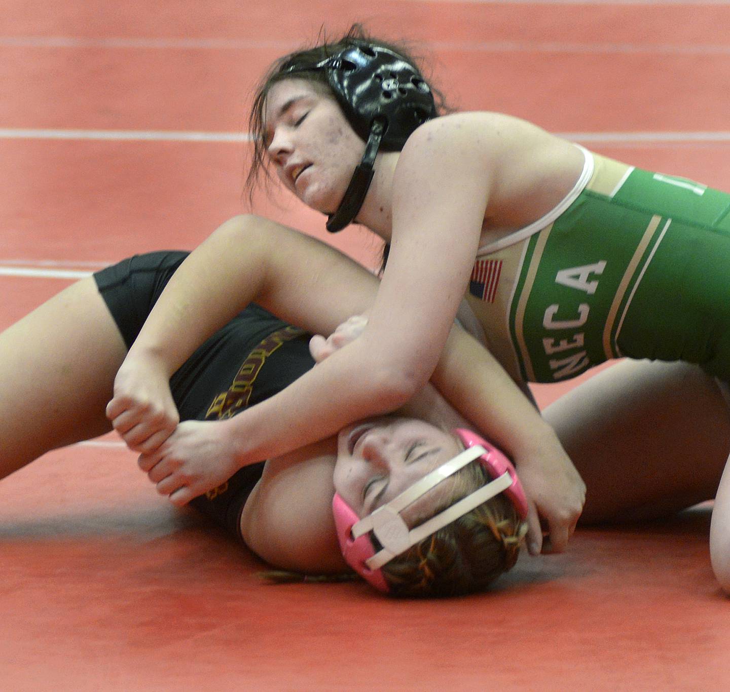 Seneca's Sammie Greisen battles with Morris's Tessa Neikirk in an Elite Bracket 135-pound bout at Monday's Ottawa Holiday Hootenanny Invite in Kingman Gymnasium.