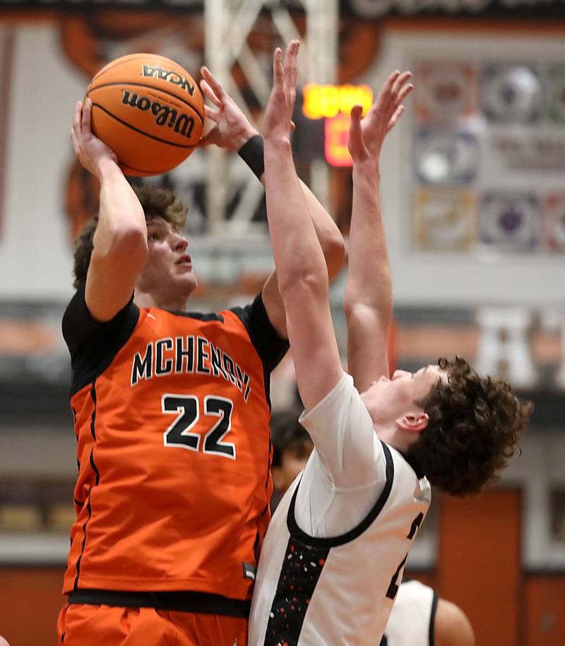 McHenry's Blake Renfro shoots the ball over Crystal Lake Central's Danny Spychala during a Fox Valley Conference boys basketball game on Tuesday, February. 10, 2026, at Crystal Lake Central High School.