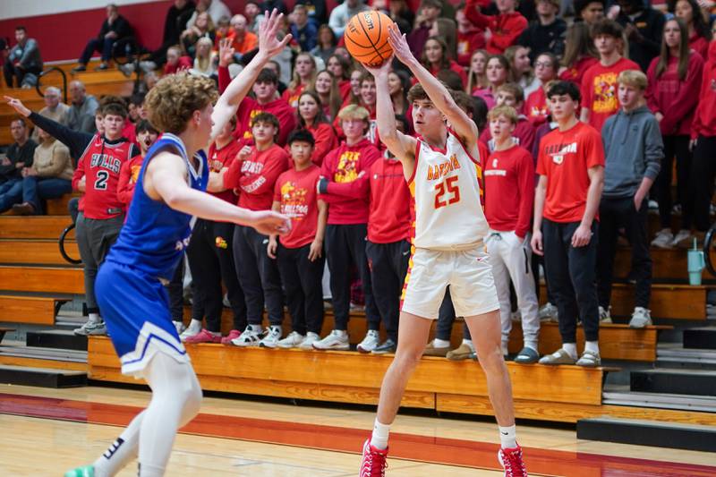 Batavia’s Joe Schroeder (25) shoots a three pointer against Marmion's Caden Anderson (2) during a basketball game at Batavia High School on Wednesday, Nov. 27, 2024.