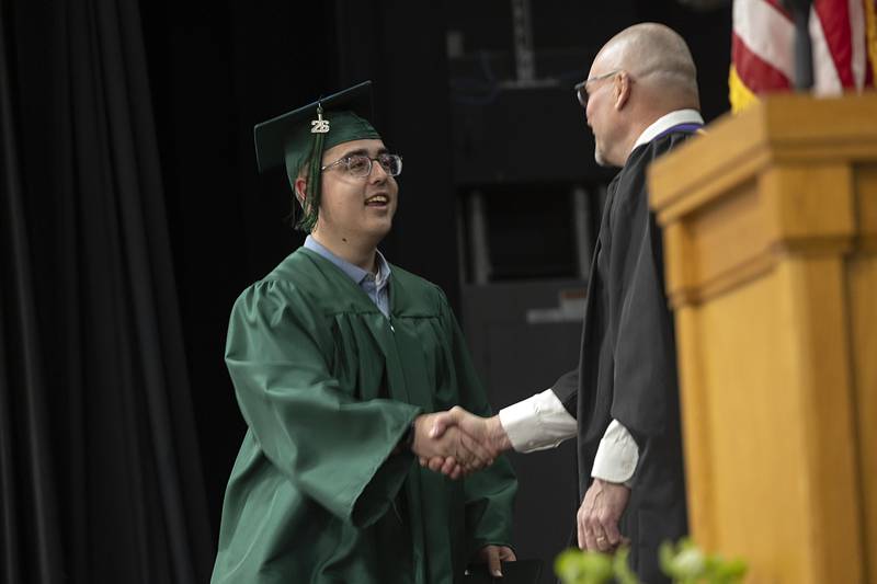 Maddox Korstick receives his diploma Sunday, May 17, 2026, during Rock Falls High School’s commencement of the class of 2026.
