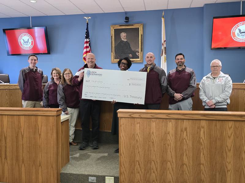 (From left) Deputy Clerk Brent Bader, Administrative Assistant Julie Gunia, Parks and Rec Director Lynda Kasik, Mayor Jeff Grove, U.S. Rep. Lauren Underwood, D-Naperville; Economic Development Director Curt Bedei, Finance Director John Duncan and Fire Chief Jerry Janick pose for a photo as the Congresswoman visits La Salle City Hall on Thursday, Feb. 20, 2025.