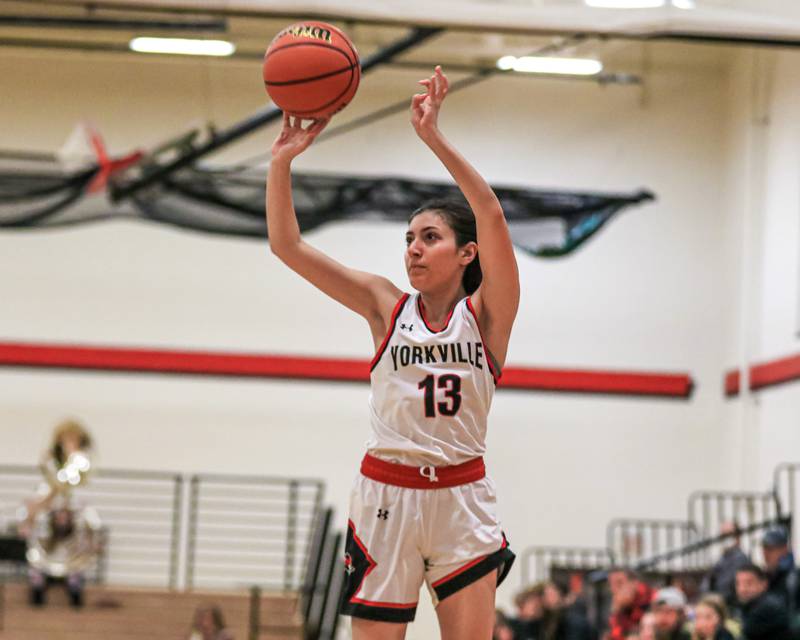 Yorkville's Kaelie Moreno (13) shoots a jumper during varsity basketball game between Kaneland at Yorkville. Dec 14, 2022.