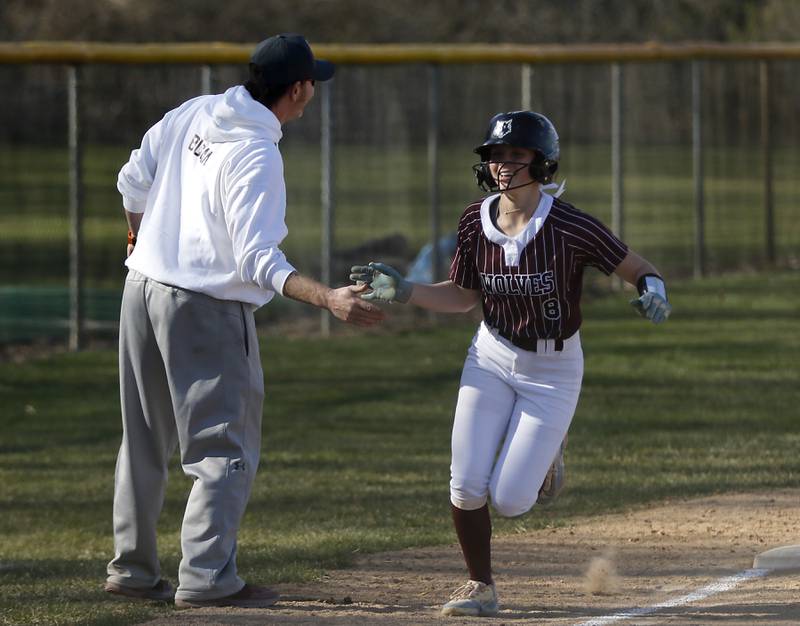 Prairie Ridge's Ady Kiddy is congratulated by coach Scott Busam after she hit a home run during Fox Valley Conference softball game against Huntley on Monday, April 14, 2025, at Prairie Ridge High School in Crystal Lake.