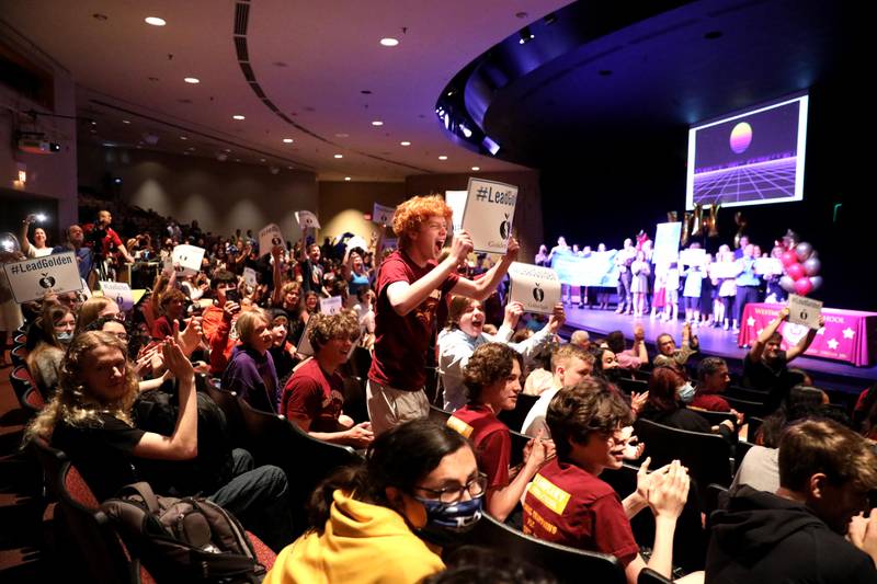Westmont High School students cheer on Principal Jack Baldermann as he was honored with a surprise all-school assembly to announce his Golden Apple Award for Excellence in Leadership on Thursday, May 12, 2022.