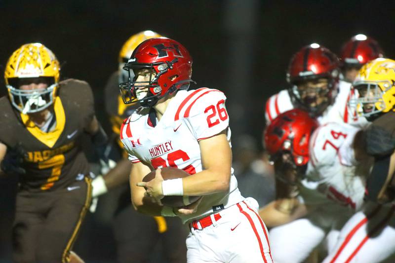 Huntley’s Chase Hojnacki runs the ball in varsity football at Jacobs High School in Algonquin on Friday, Sept. 26, 2025.