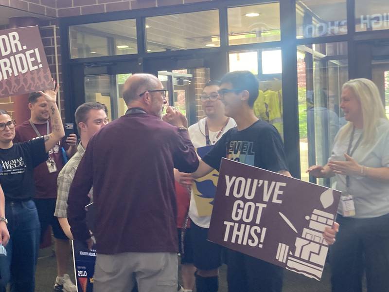 LTHS Superintendent Dr. Robert McBride greets students after walking into his surprise Boston Marathon send-off on Friday, April 17, 2026.