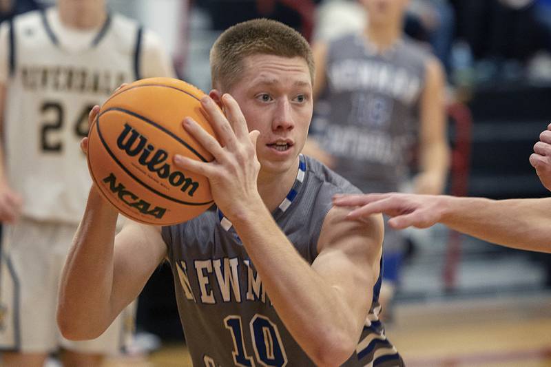Newman’s George Jungerman looks to make a play against Riverdale Tuesday, Dec. 30, 2025, in the final of the boys Cliff Warkins Basketball Tournament at Erie High School.