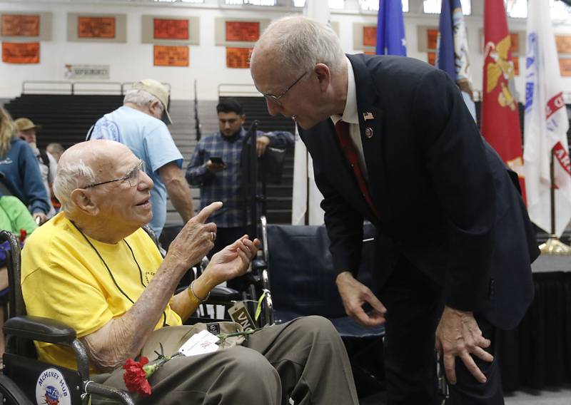 World War II U.S. Marine Corps veteran John Rickerd talks with U.S. Rep. Bill Foster, during a homecoming celebration for veterans returning from an Honor Flight trip to Washington D.C., on Sunday, Aug. 27, 2023.