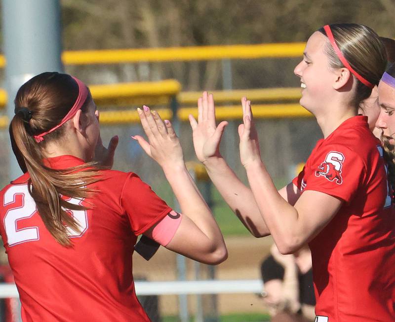 Streator's Aubree Galick hi-fives teammate Lexi Fialko after scoring on a penalty kick against Serena/Newark/Earlville on Thursday, April 16, 2026 at the James Street Recreational Complex in Streator.