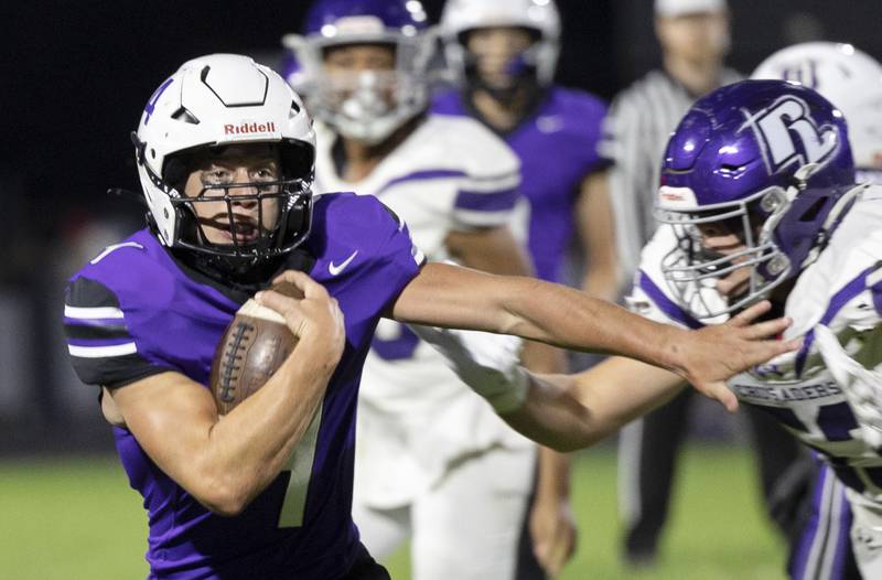 Dixon’s Landon Knigge hits the hole against the Rockford Lutheran defense Friday, Sept. 27, 2024, at A.C. Bowers Field in Dixon.