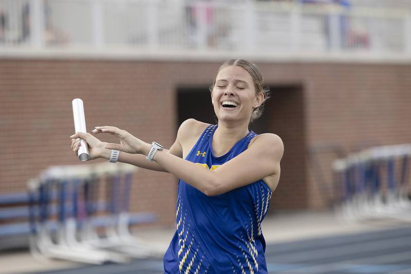 Aurora Catholic’s Nicole Smith finishes her team’s qualifying 4x800 race Wednesday, May 14, 2025, during Sectionals at Sterling High School.