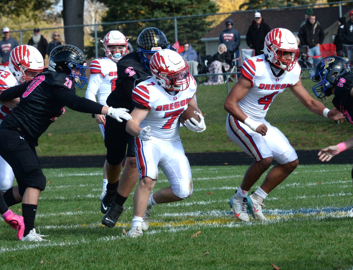 Oregon's Logan Weems runs with the ball as Quentin Berry looks to block during 3A playoff action against Durand-Pecatonica on Saturday, Oct. 28, 2023 at Pecatonica High School.