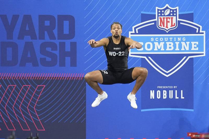 Washington wide receiver Rome Odunze runs a drill at the NFL football scouting combine, Saturday, March 2, 2024, in Indianapolis. (AP Photo/Michael Conroy)