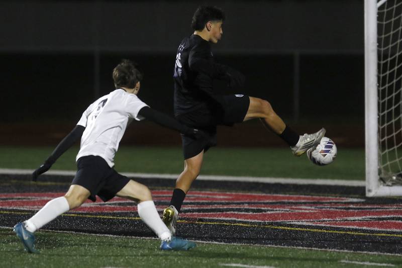 St. Charles North's Wicho DelaPaz scores a goal during an IHSA Class 3A Huntley Regional boys soccer semifinal match against McHenry on Tuesday, Oct. 21, 2025, at Huntley High School.