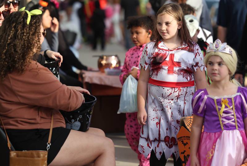 Costumed visitors of all types made their way down the sidewalk along Lincoln Highway during the DeKalb Chamber of Commerce’s annual Spooktacular Tuesday, Oct. 29, 2024, in downtown DeKalb.