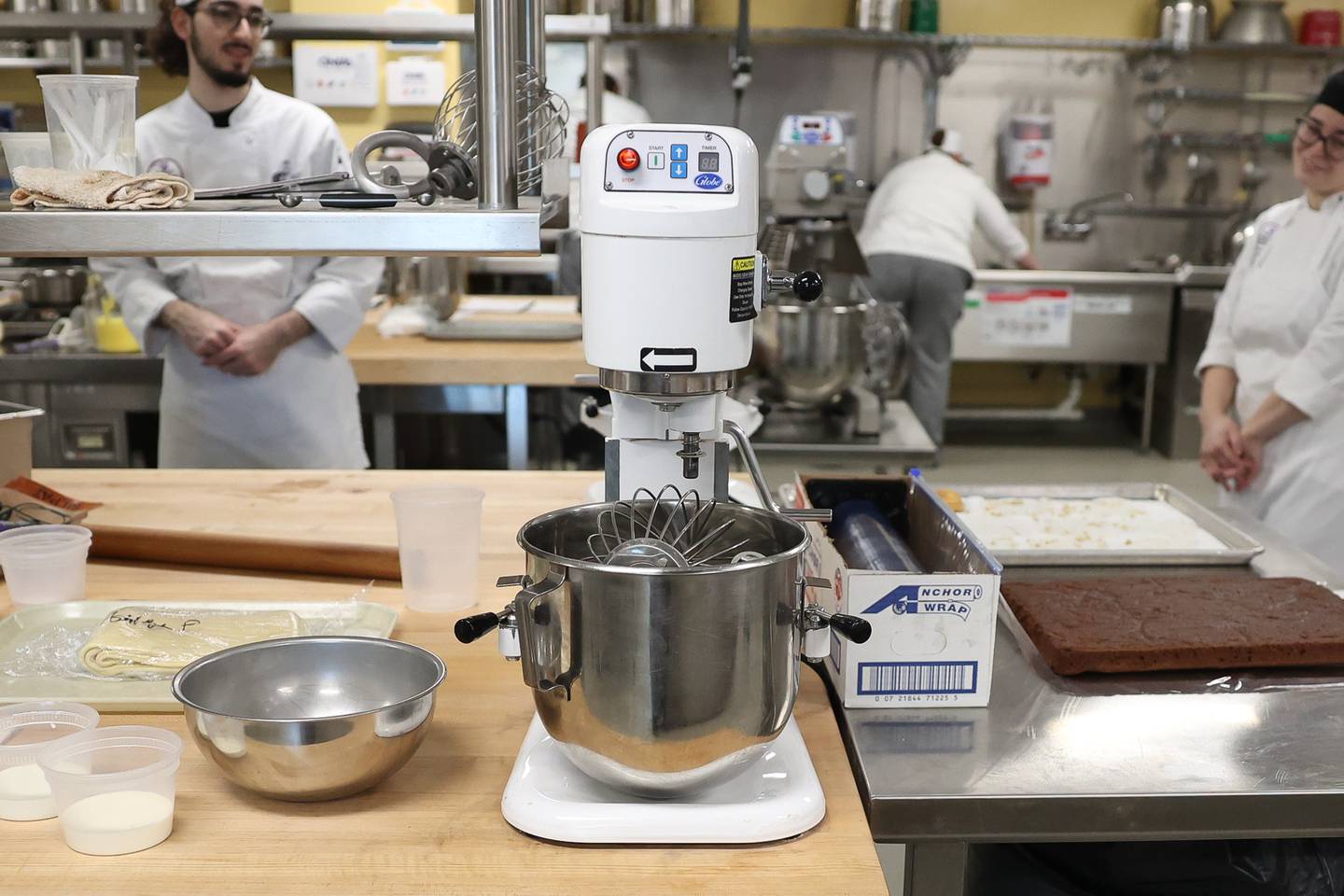 A mixer sits at a station at one of Chef Andy Chlebana pastry classes at the Joliet Junior College City Center Campus on Wednesday, March 1st, 2023. Andy has won numerous awards, including 1st place in two competitive television series on the Food Network.