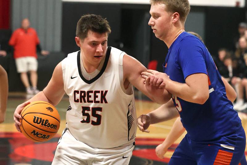 Indian Creek's Payton Hueber tries to drive by Genoa-Kingston's Hayden Hodgson during their game Friday, Jan. 3, 2025, at Indian Creek High School in Shabbona.