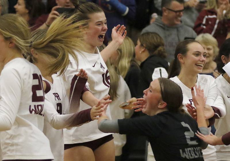 Prairie Ridge's Allison Rodgers celebrates with teammates after thy defeated St. Francis in the IHSA Class 3A Grayslake Central Supersectional volleyball match on Monday, Nov. 11, 2024, at Grayslake Central High School.