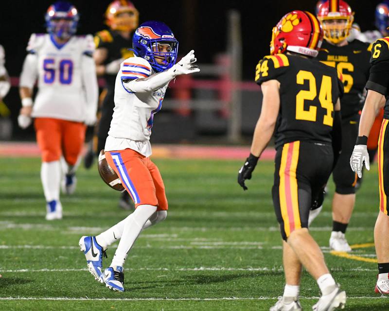 Hoffman Estates's Brandon Smith, left, celebrates his first down during the first round of playoffs  while traveling to take on Batavia on Friday Oct. 31, 2025, held at Batavia High School