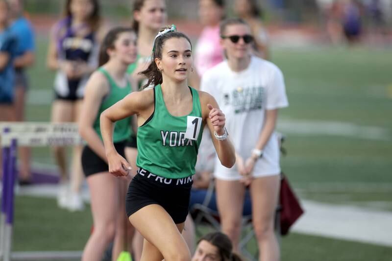 York’s Bria Bennis wins the second section of the 3,200-meter run during the Ritter Invite girls track and field meet at Downers Grove North on Friday, April 14, 2023.