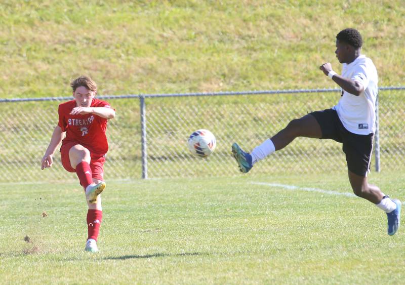 Streator's Noah Russow kicks the ball down the field as Galesburg's Anthony Makwala fails to deflect it out of bounce during the Class 2A Regional final on Saturday, Oct. 26, 2024 at Ottawa High School.