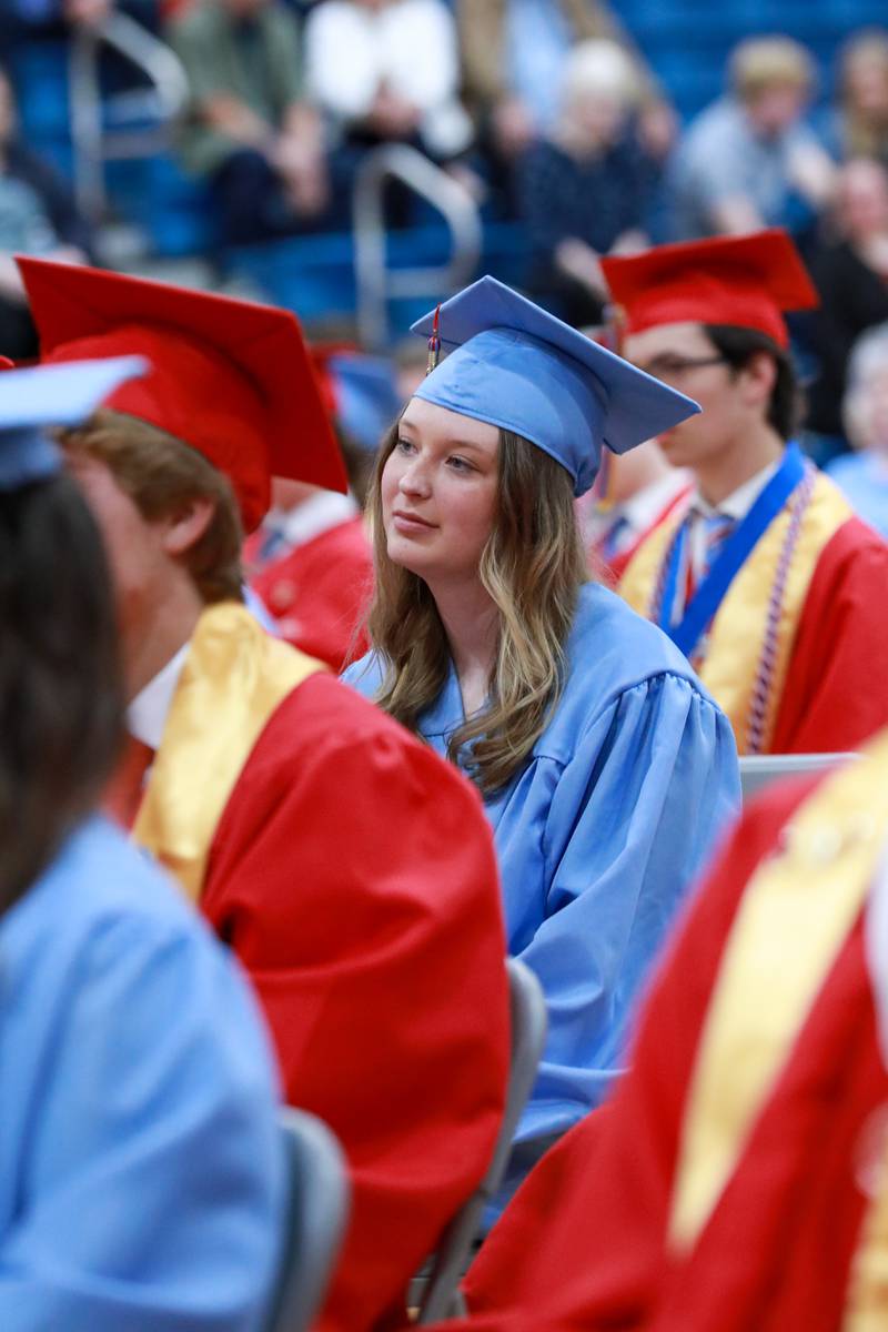Emma Johnson listens to Valedictorian Matthew Martin offer graduation advice for classmates Friday, May 27, 2022, at Marian Central Catholic High School in Woodstock.