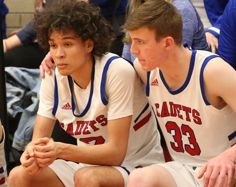 Marmion's James Kennedy hugs teammate Jabe Haith after loosing to Metamora in the Class 3A Super-Sectional on Monday, March 6, 2023 at Ottawa High School.