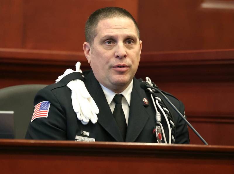 Bill Reynolds, firefighter/paramedic with the Sycamore Fire Department, testifies during the trial of Jonathan Hurst Thursday, Jan. 23, 2025, at the DeKalb County Courthouse, about what he saw upon arrival at the scene where Sycamore elderly mother and son Patricia and Robert Wilson were found dead. Hurst is charged in the 2016 slayings of the Wilsons.