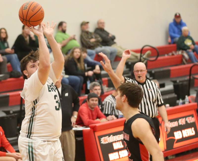 St. Bede's Sam Bima shoots a three-point basket over Stillman Valley's Jacob Rhodes during the 49th annual Colmone Class on Thursday, Dec. 7, 2023 at Hall High School.