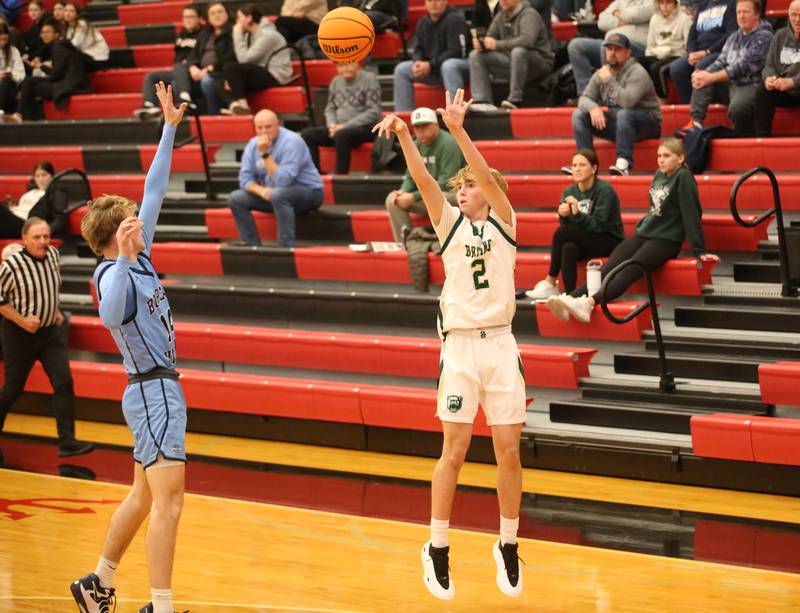 St. Bede's Kaden Nauman drains a three-point basket over Bureau Valley's Zax Wiggim during the 50th annual Colmone Classic on Thursday, Dec. 12, 2024 at Hall High School.