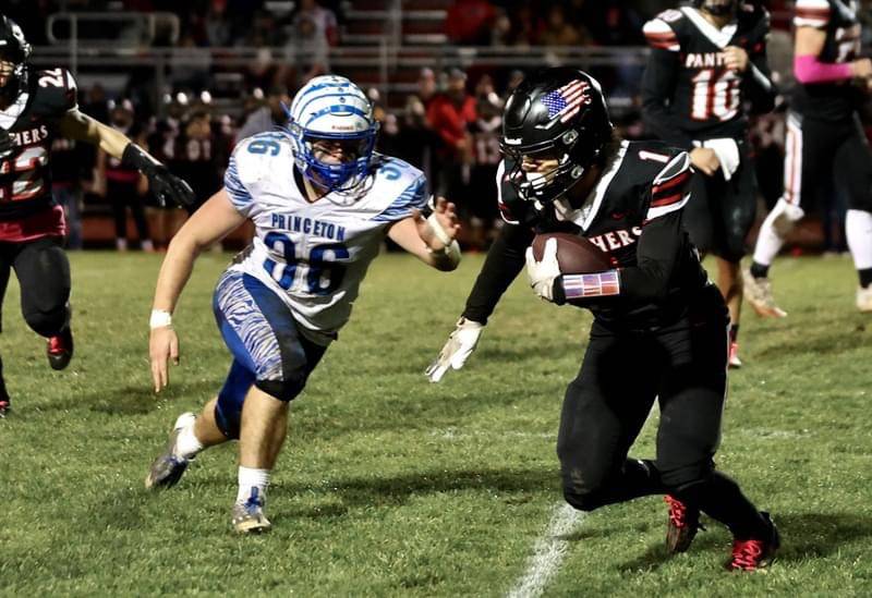 Princeton's Common Green zeroes in on Erie-Prophetstown's Demetree Larsen Friday night at Prophetstown. The Tigers won 61-14.