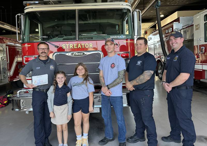 St. Michael the Archangel Catholic School in Streator students share thank you cards with the Streator Fire Department in honor of the Feast Day of St. Michael.