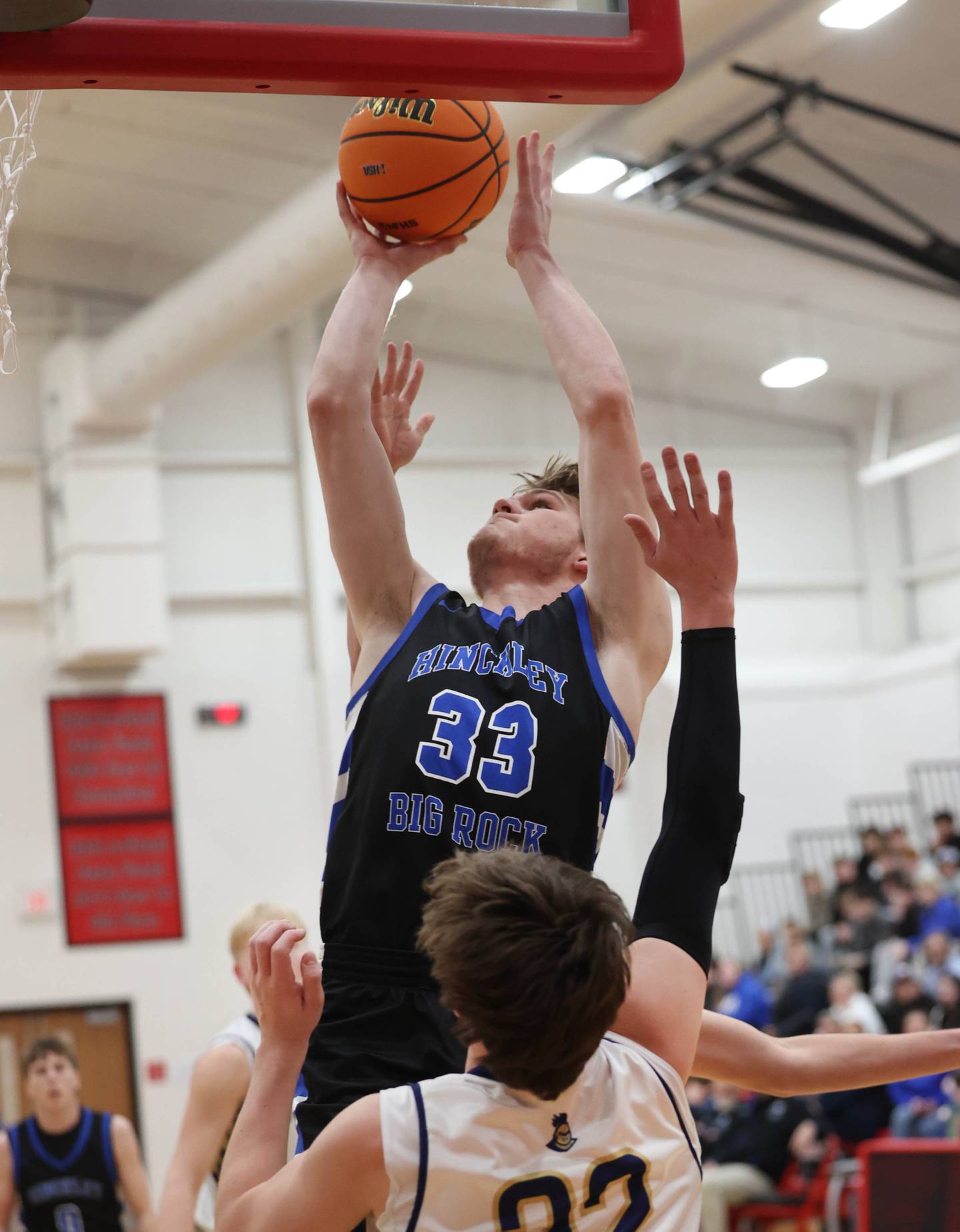 Hinckley-Big Rock's Marshall Ledbetter shoots over Marquette's Griffin Dobberstein Tuesday, March 3, 2026, during their sectional semifinal matchup at Amboy High School.