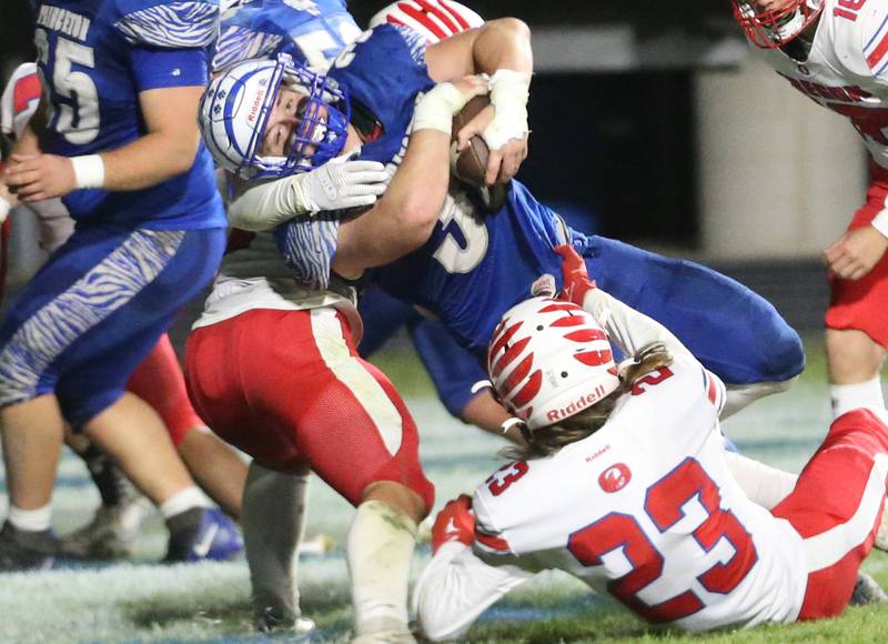 Princeton's Common Green scores a touchdown over Oregon's Jimmy Keaty during the Class 3A playoff game on Friday, Nov. 1, 2024 at Princeton High School.