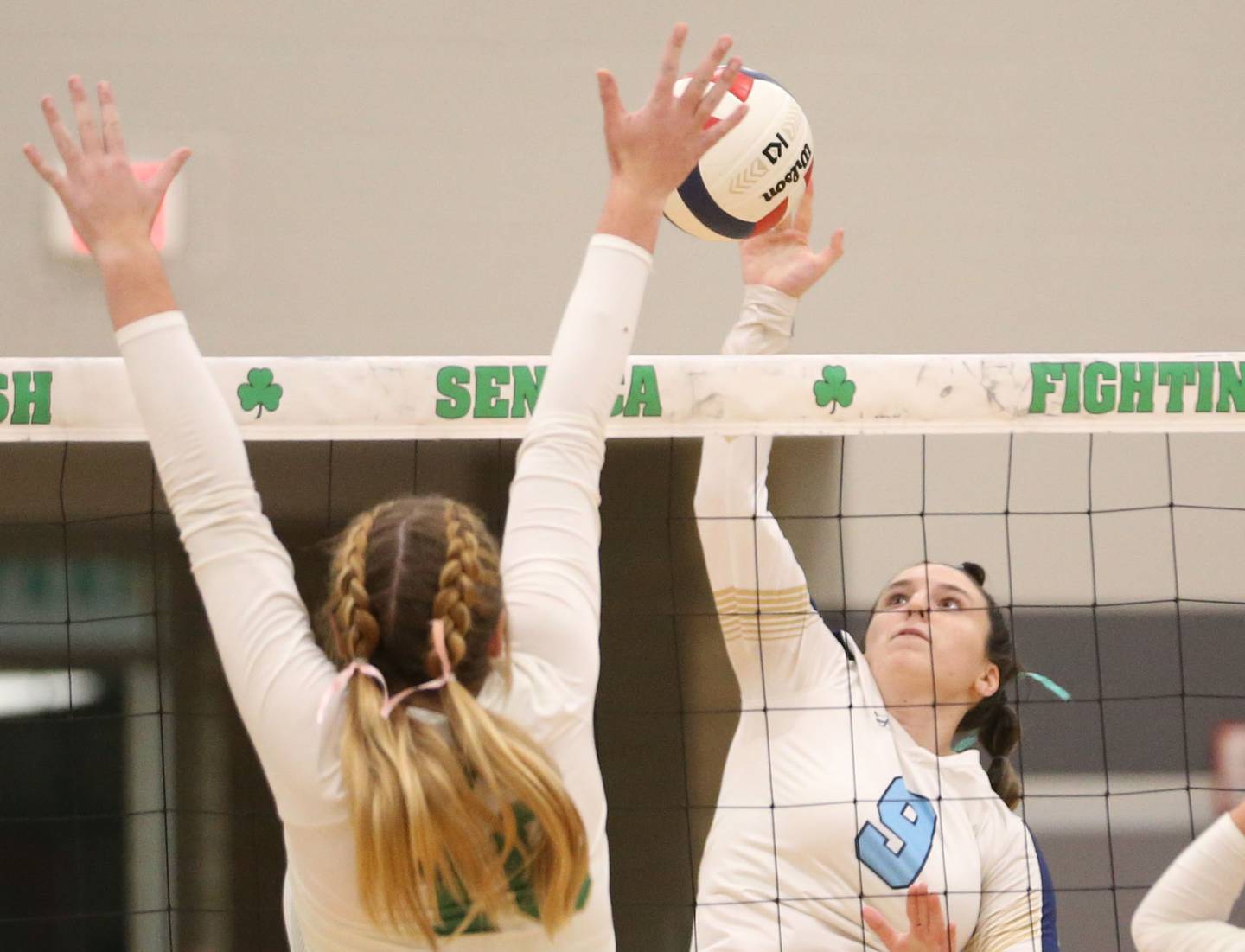 Marquette's Makayla Backos has her spike blocked by Seneca's Tessa Krull on Thursday, Sept. 19, 2024 at Seneca High School.