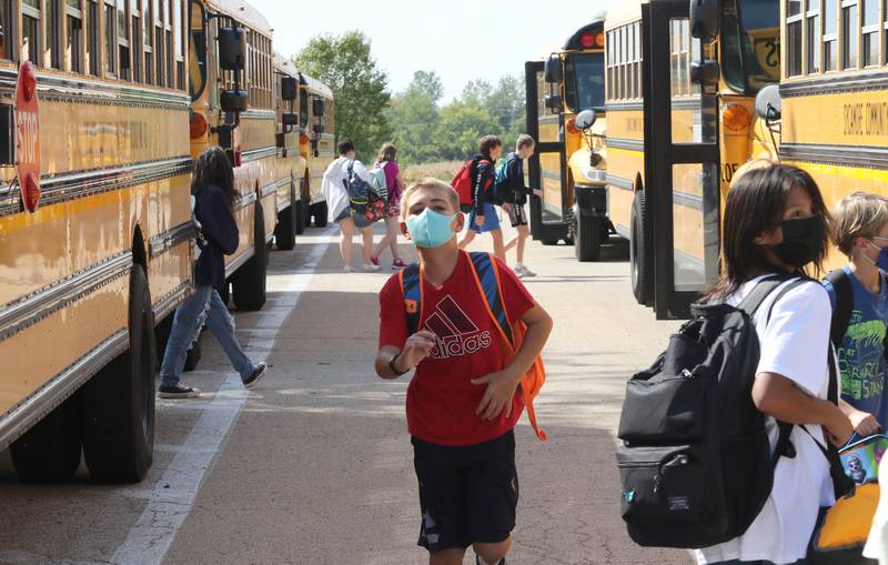 Students at Sycamore Middle School head for their buses Friday, Sep. 17, 2021 at the end of the school day.