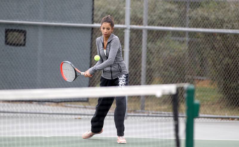 St. Charles East’s Kelsey Jacob returns the ball during the first day of the IHSA state tennis tournament at Fremd High School on Thursday, Oct. 20, 2022.