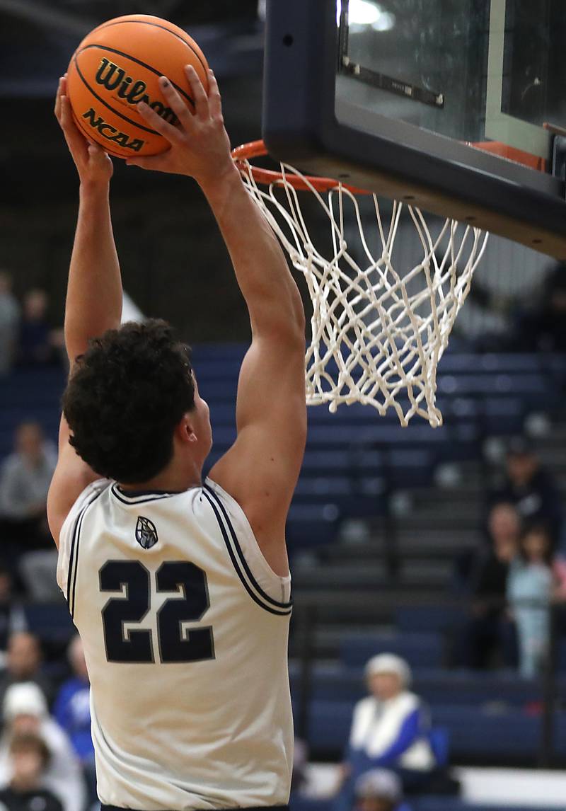 Cary-Grove's Adam Bauer dunks the ball during a Fox Valley Conference  boys basketball game against Burlington Central on Wednesday Jan. 7,  2026, at Cary-Grove High School, in Cary.