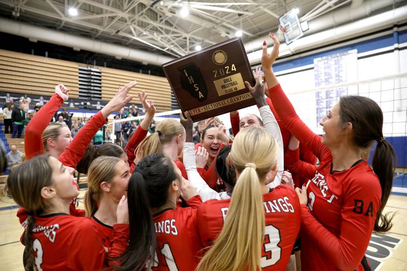 Benet players celebrate their Class 4A St. Charles North Supersectional win on Monday, Nov. 11, 2024 against New Trier.